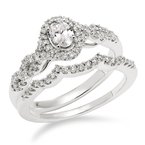 White gold and diamond oval halo bridal set