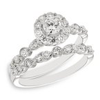 White gold and diamond halo engagement