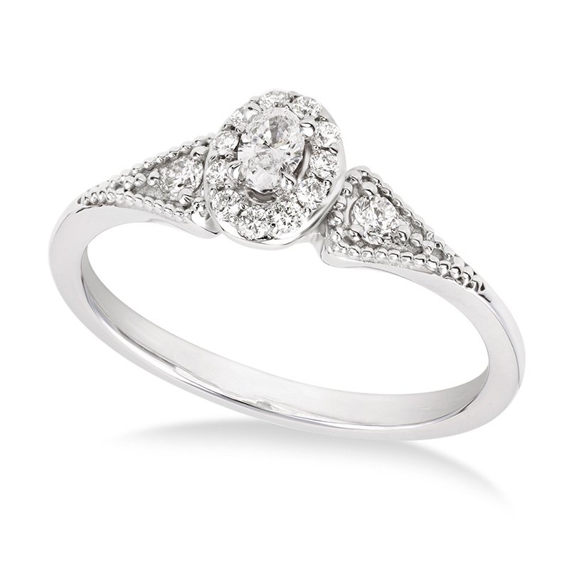 White gold, vintage-inspired petite oval diamond halo engagement ring
