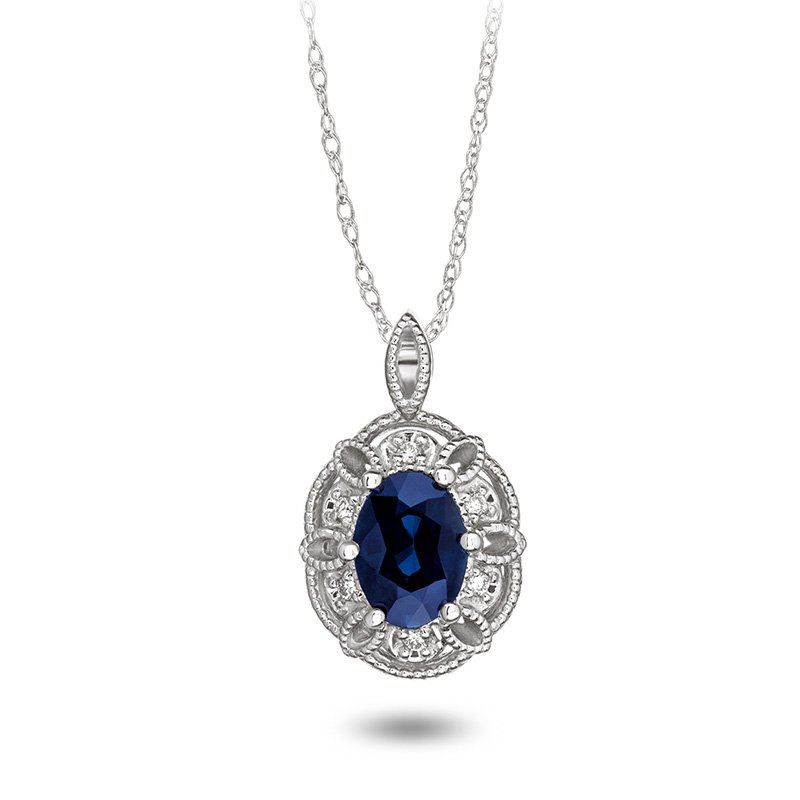 Two-tone gold, vintage-inspired, oval genuine sapphire and diamond pendant