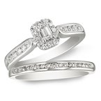 White gold, emerald-cut and round diamond halo bridal set
