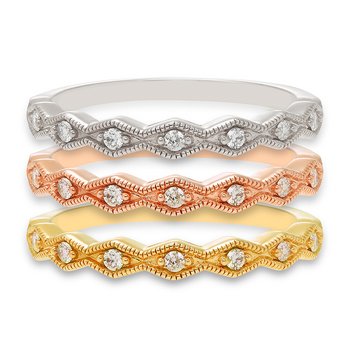 Gold bands with a diamond-shaped pattern and round diamonds