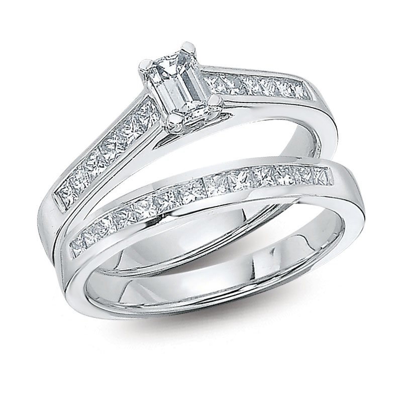 White gold, emerald-cut diamond bridal set with channel-set diamond shank